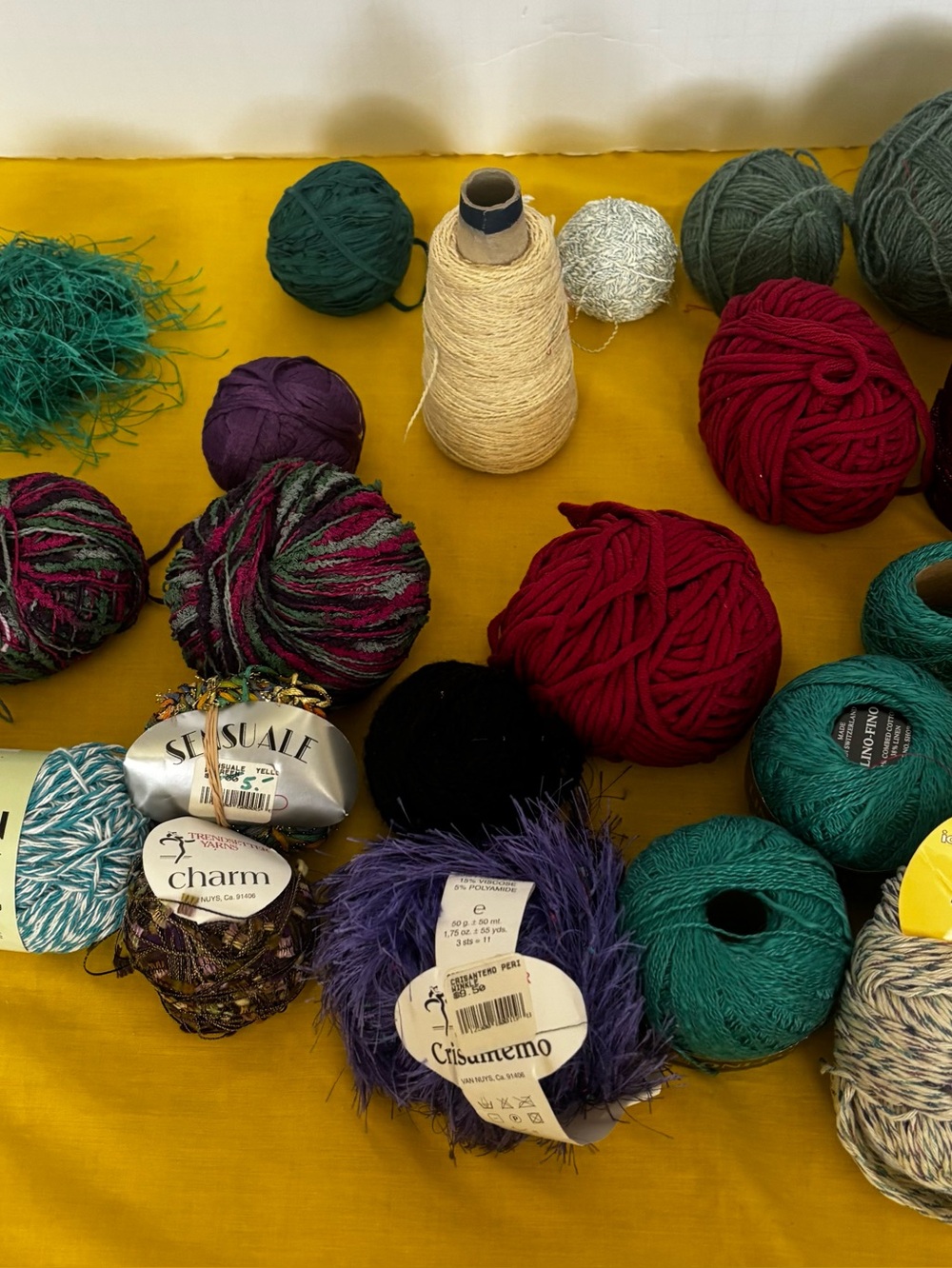 Colorful Yarn Assortment — Mixed Fiber Skeins in Red, Teal, Purple, Cream, Black